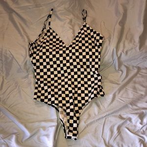 Black and white checkerd body suit